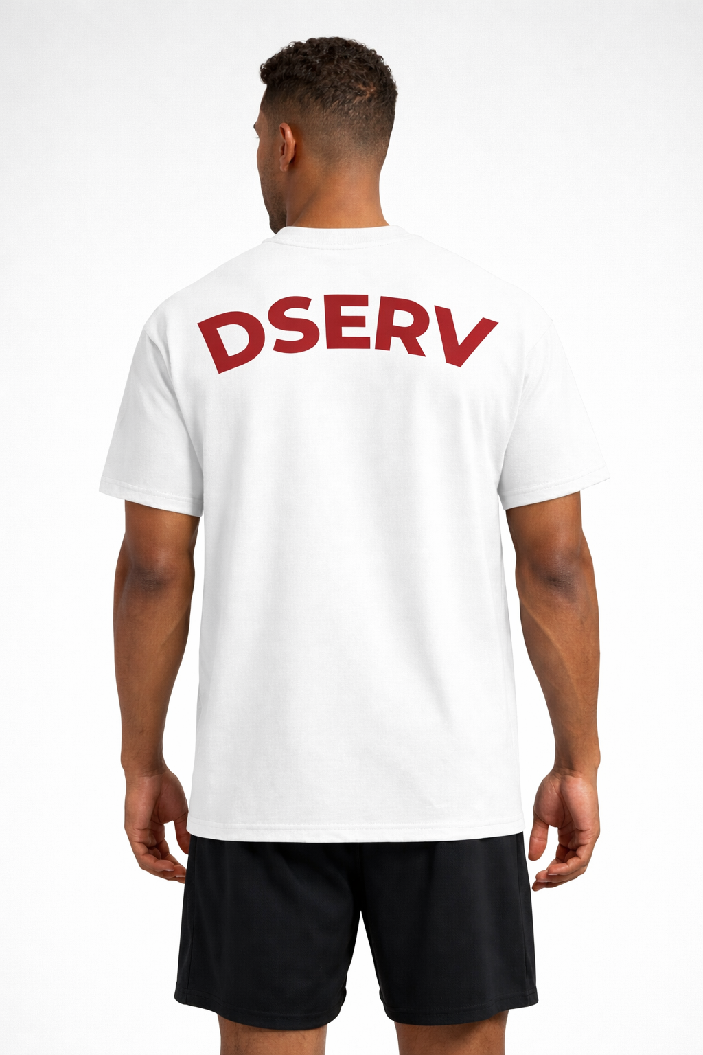 Person wearing a white t-shirt with 'DSERV' printed on the back against a white background