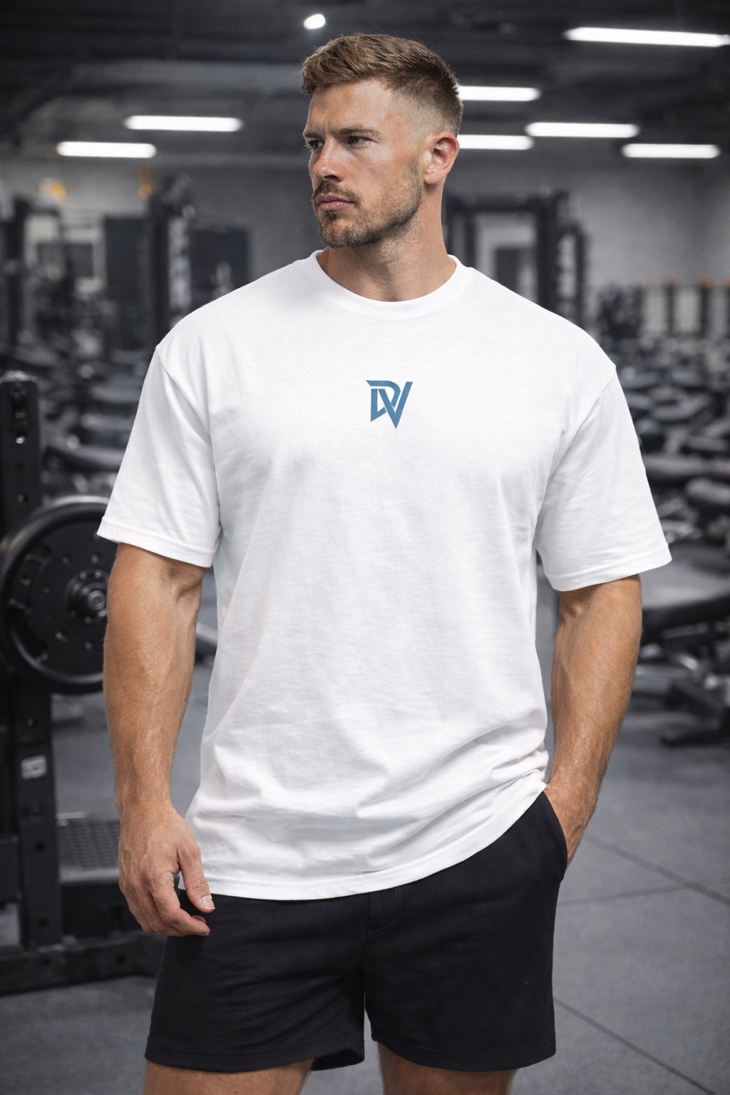 Man wearing a white t-shirt with a logo in a gym setting