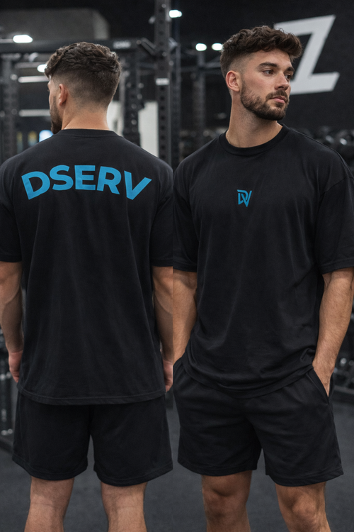 Two men wearing black t-shirts with 'DSERV' branding in a gym setting.